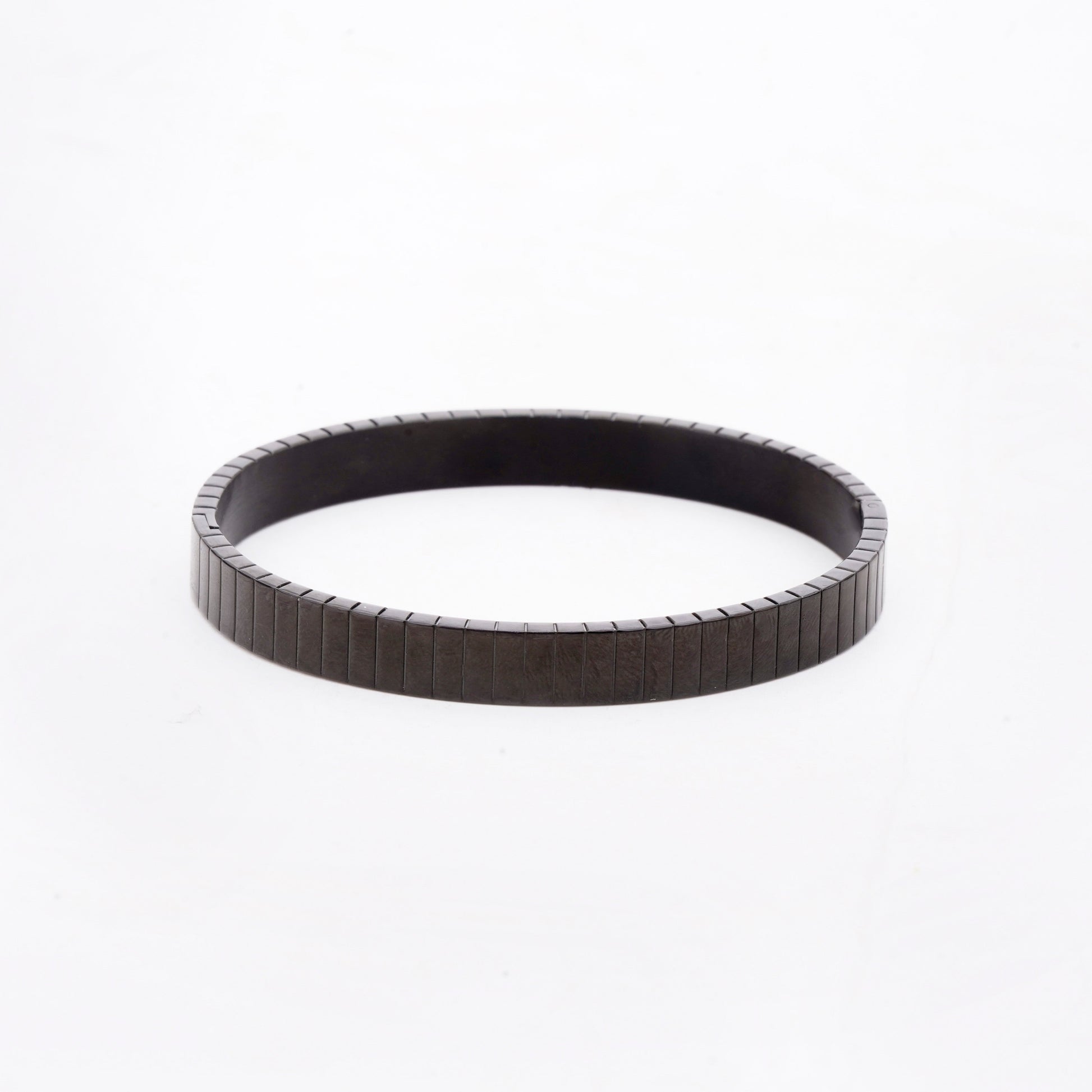 Black timing belt on a white background