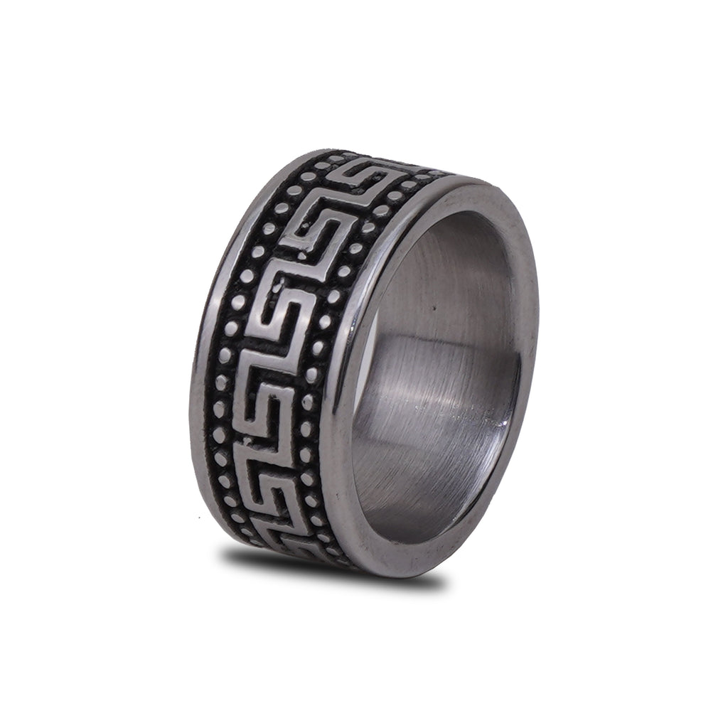 Tungsten ring with black engraved pattern on a white background