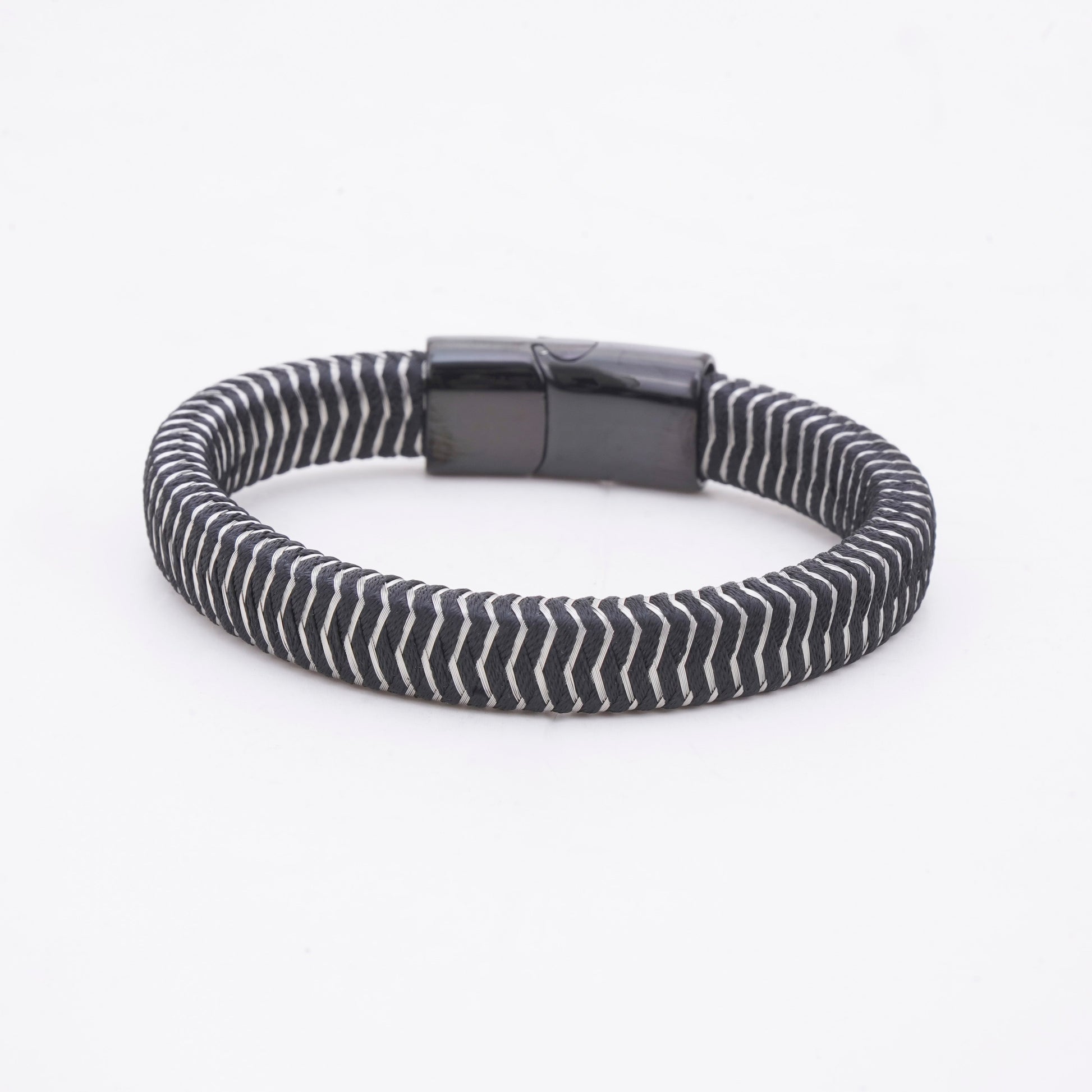 Black and white striped bracelet on a white background