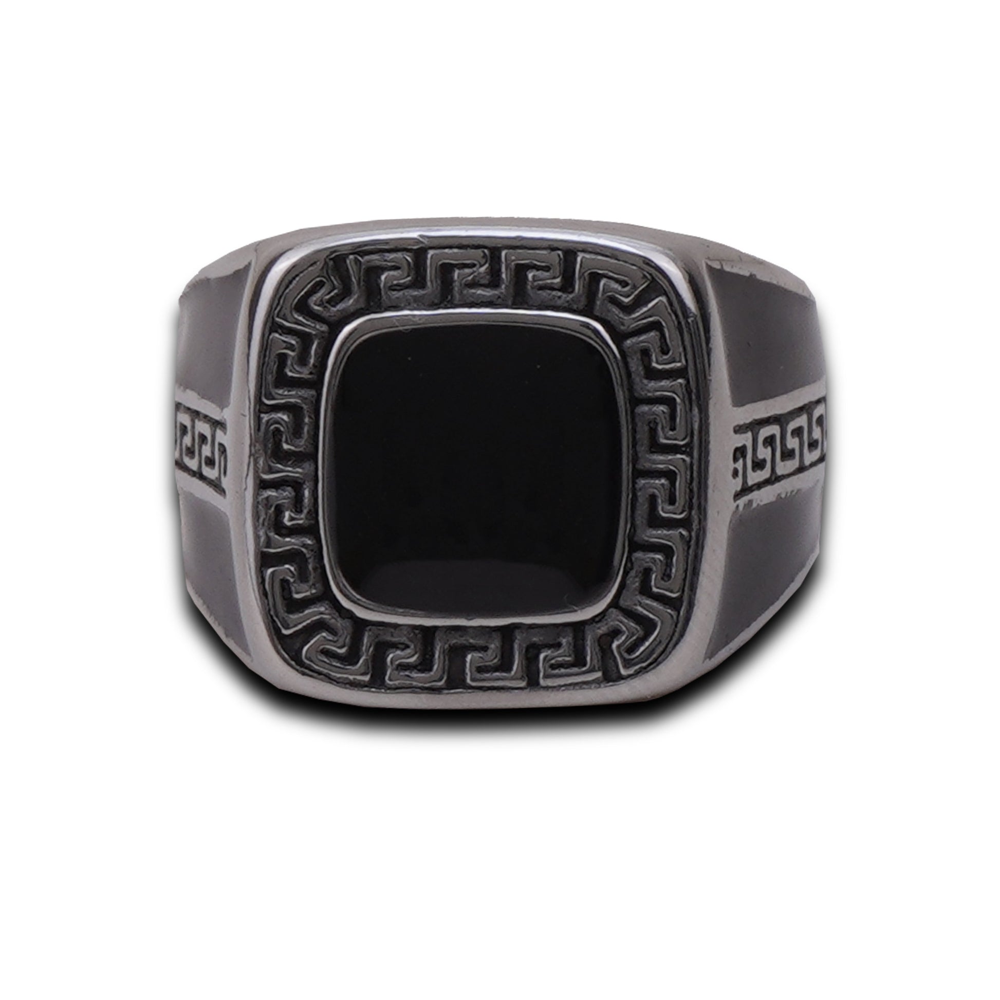 Silver ring with intricate design on a white background