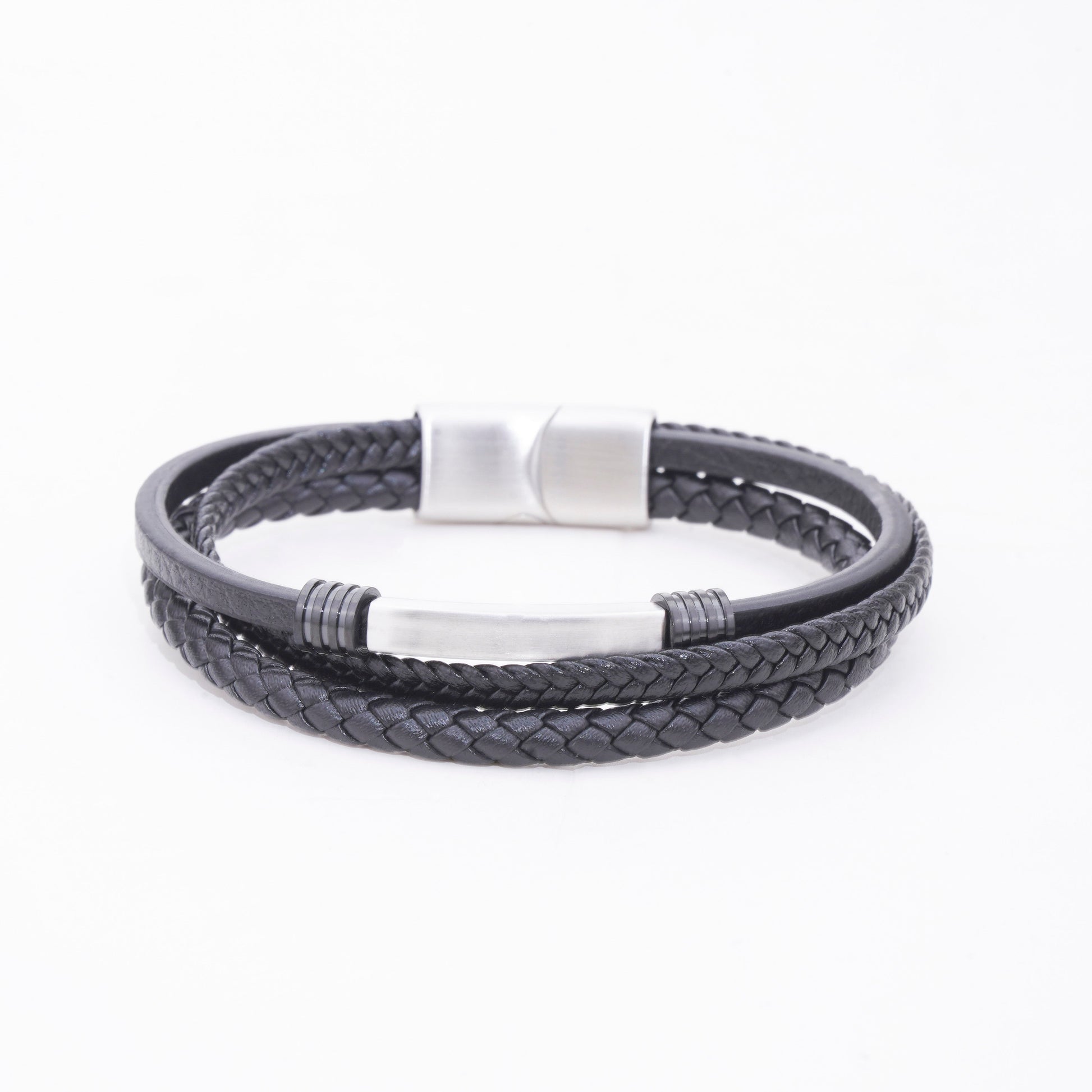 Black braided leather bracelet with silver accents on a white background